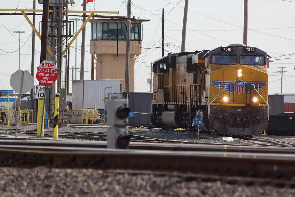 Union Pacific diesel locomotives at a rail yard fueling rack