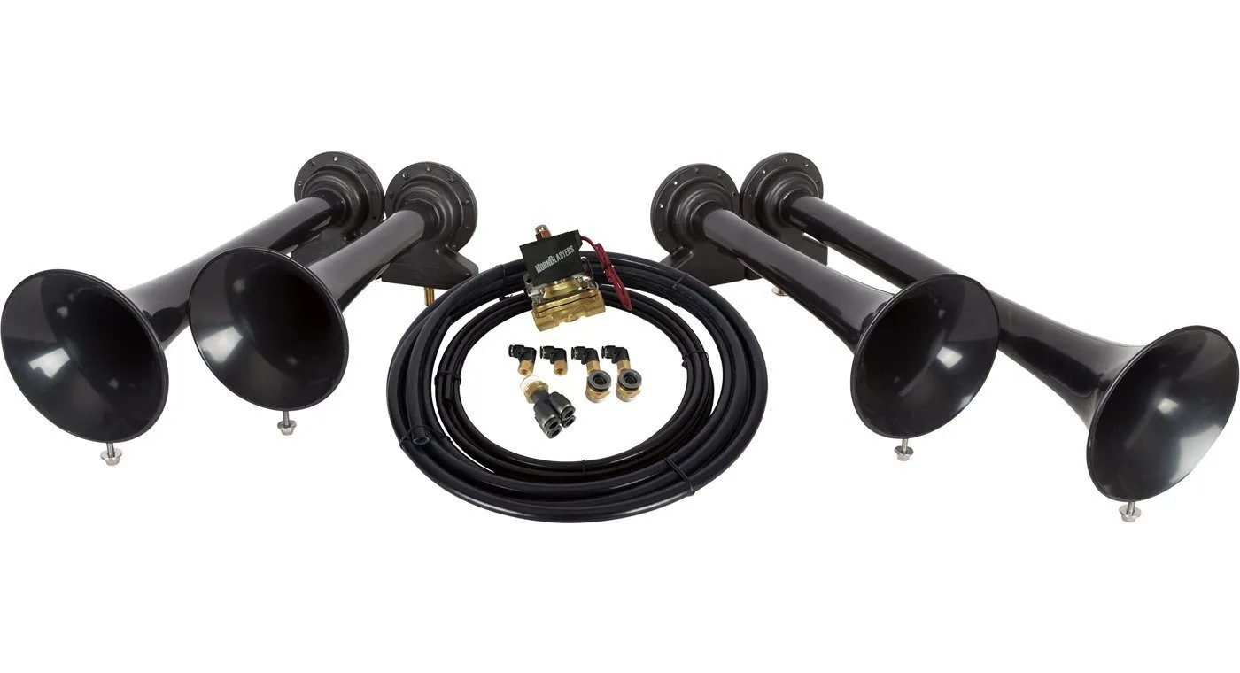 Four-trumpet aftermarket train horn kit laid out with solenoid valve, air line, and fittings, the components to inspect on a used kit