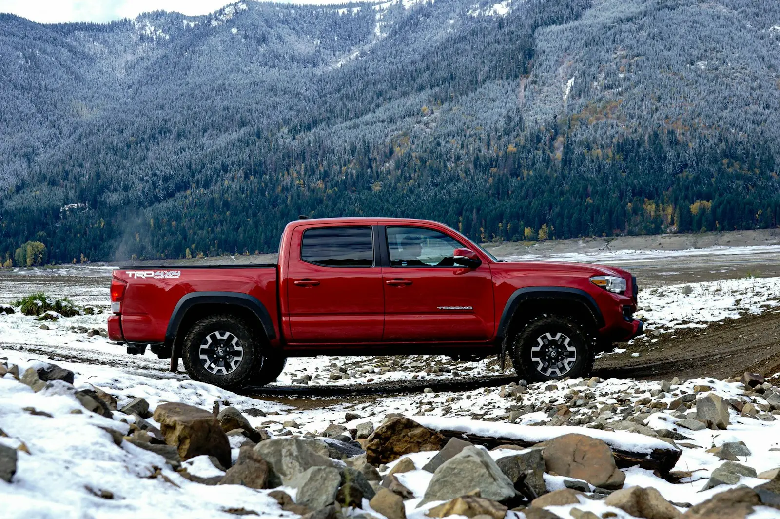 Chevrolet Silverado driving on a wet road — Silverado install context (T1 platform secondary battery tray fits Vixen 0.5-gal kits)