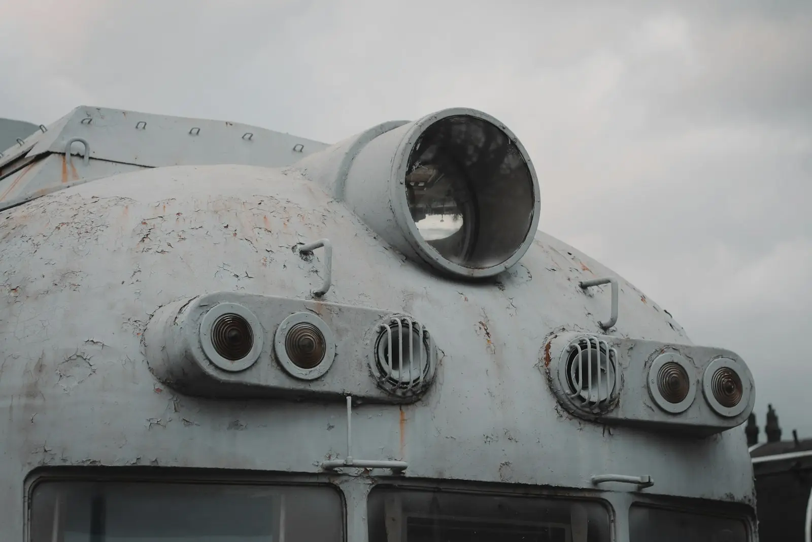 A close up of the front of an old train