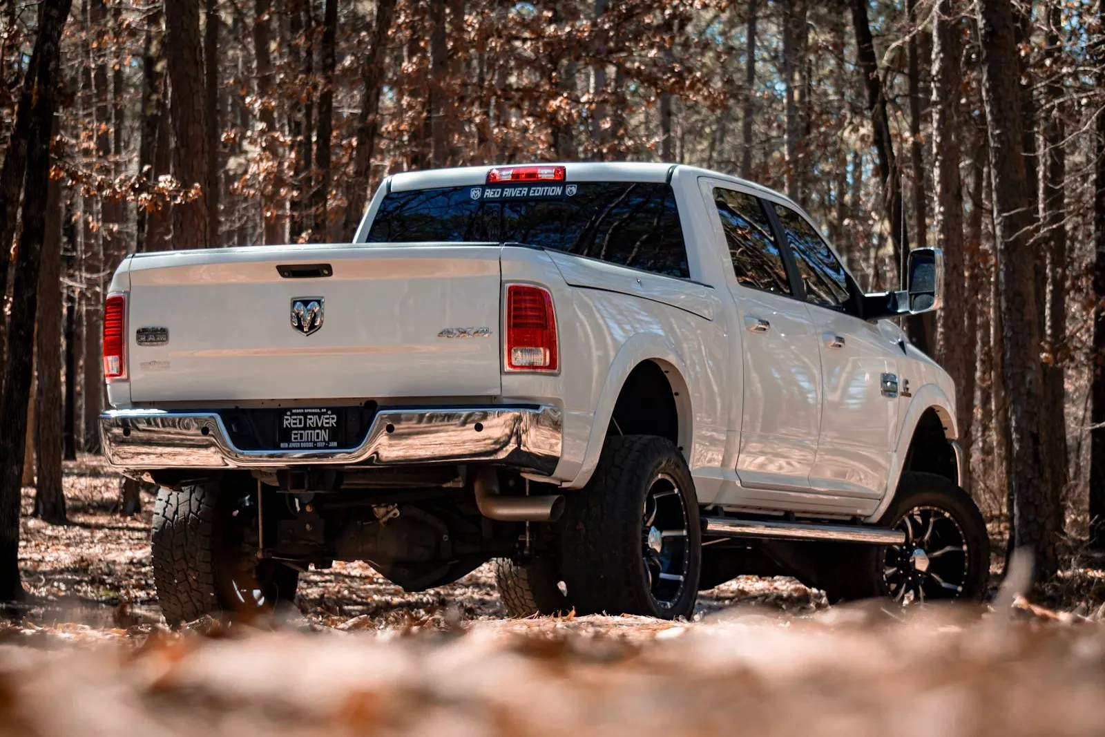 White Dodge crew cab pickup — compact pickup install context where the single-trumpet Outlaw 127H fits