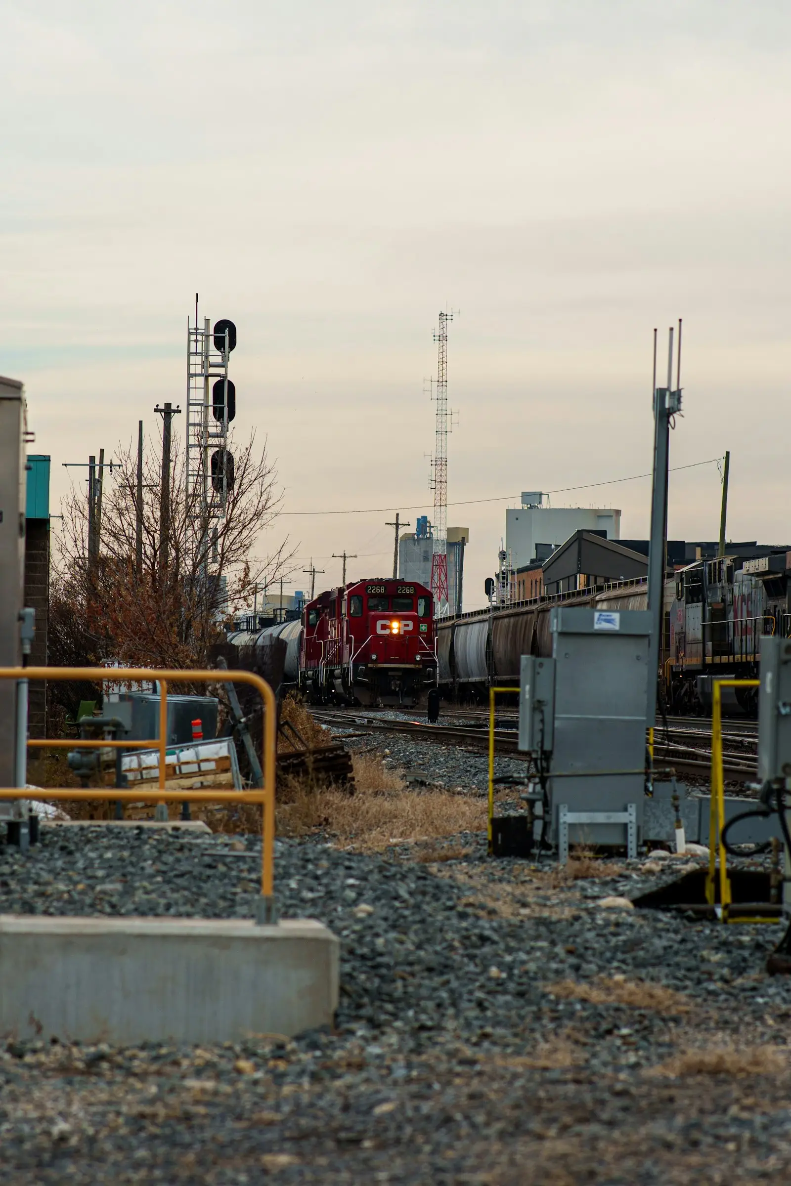 Red freight locomotive pulling cars — the kind of switcher / short-line power where the K3LA appears today
