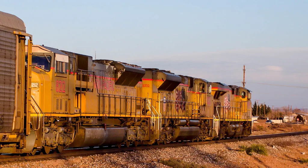 Union Pacific freight locomotive pulling a train along the tracks
