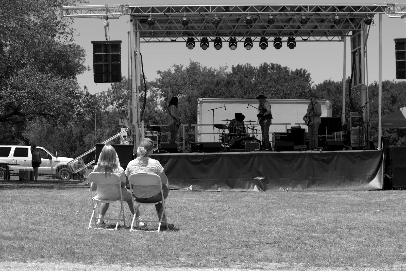 Audience watching outdoor band performance — country music concert culture and Luke Bryan's truck-prank stage moments