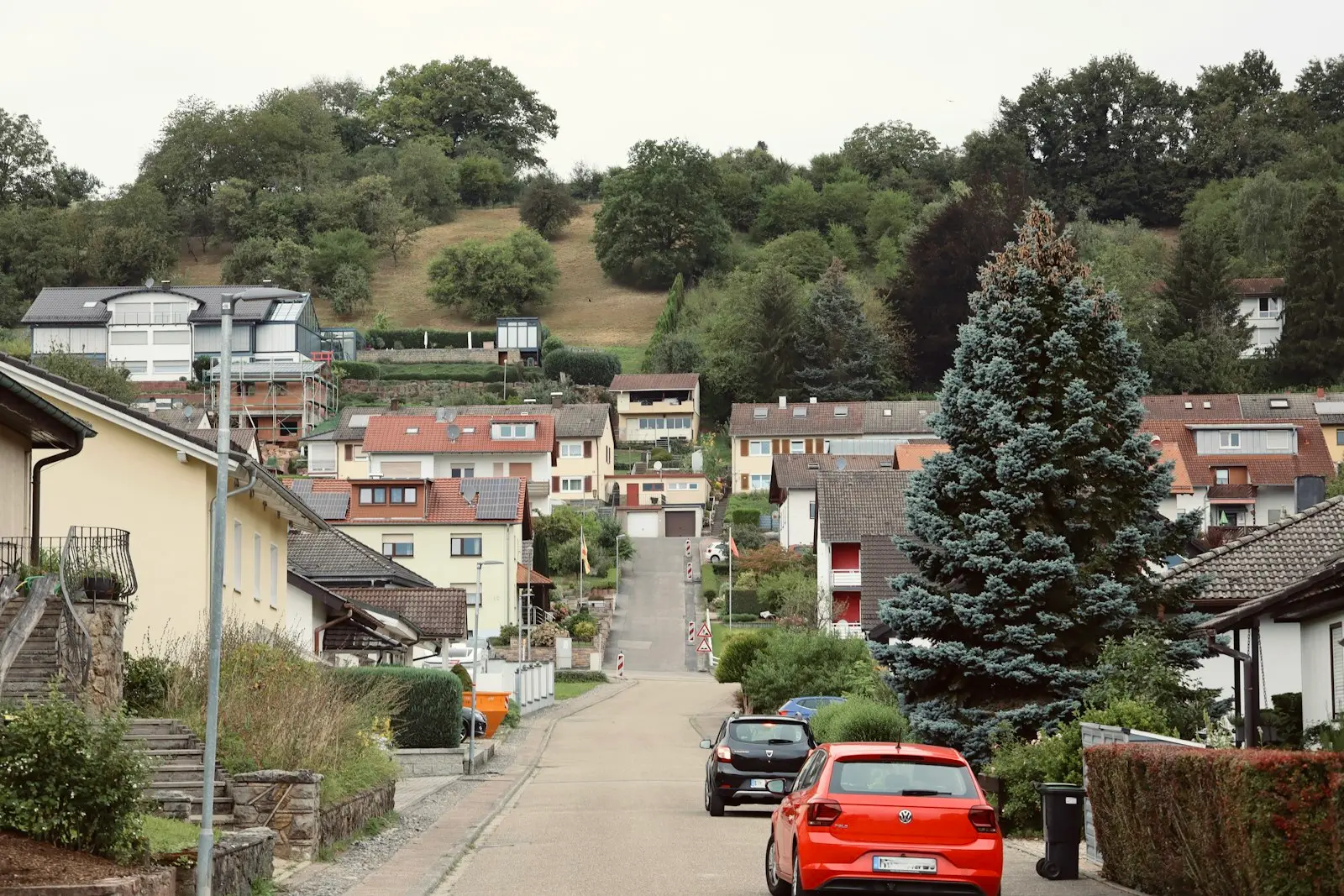 Quiet residential street with houses and trees — the kind of neighborhood that benefits from FRA quiet zones