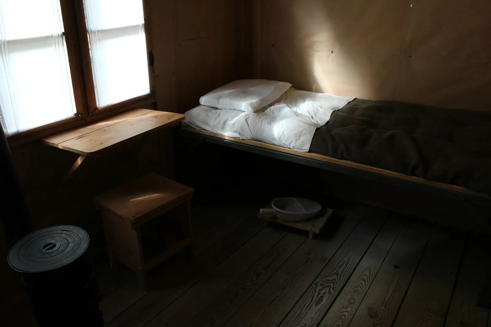 A peaceful bedroom with a bed by the window — the sleep / focus context for distant train horn ambient audio