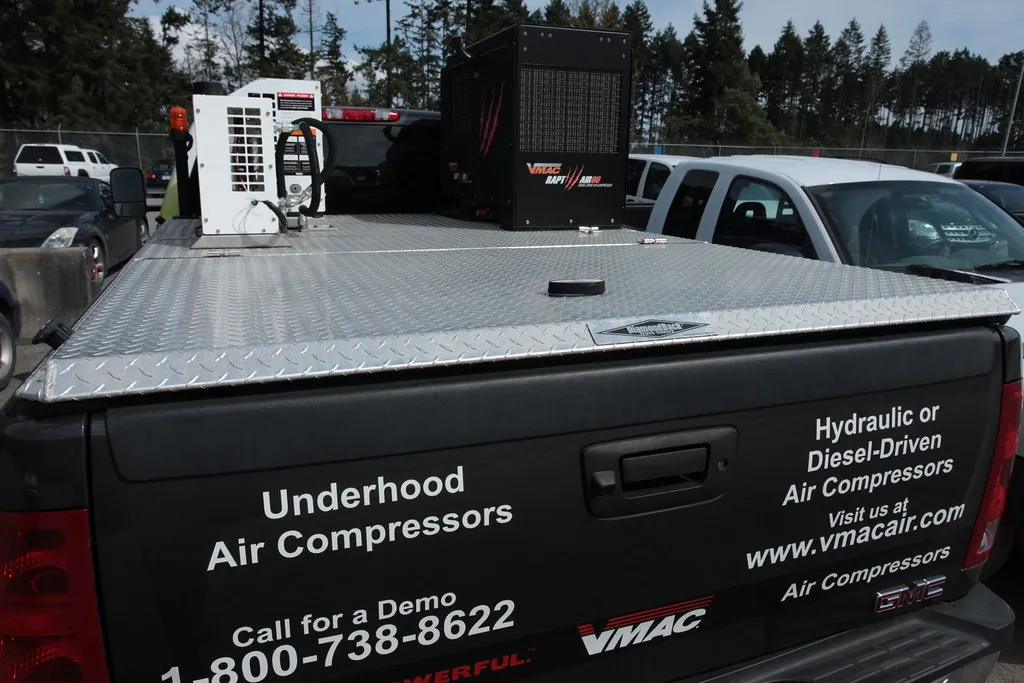 Vehicle-mounted air compressors on the bed of a pickup truck