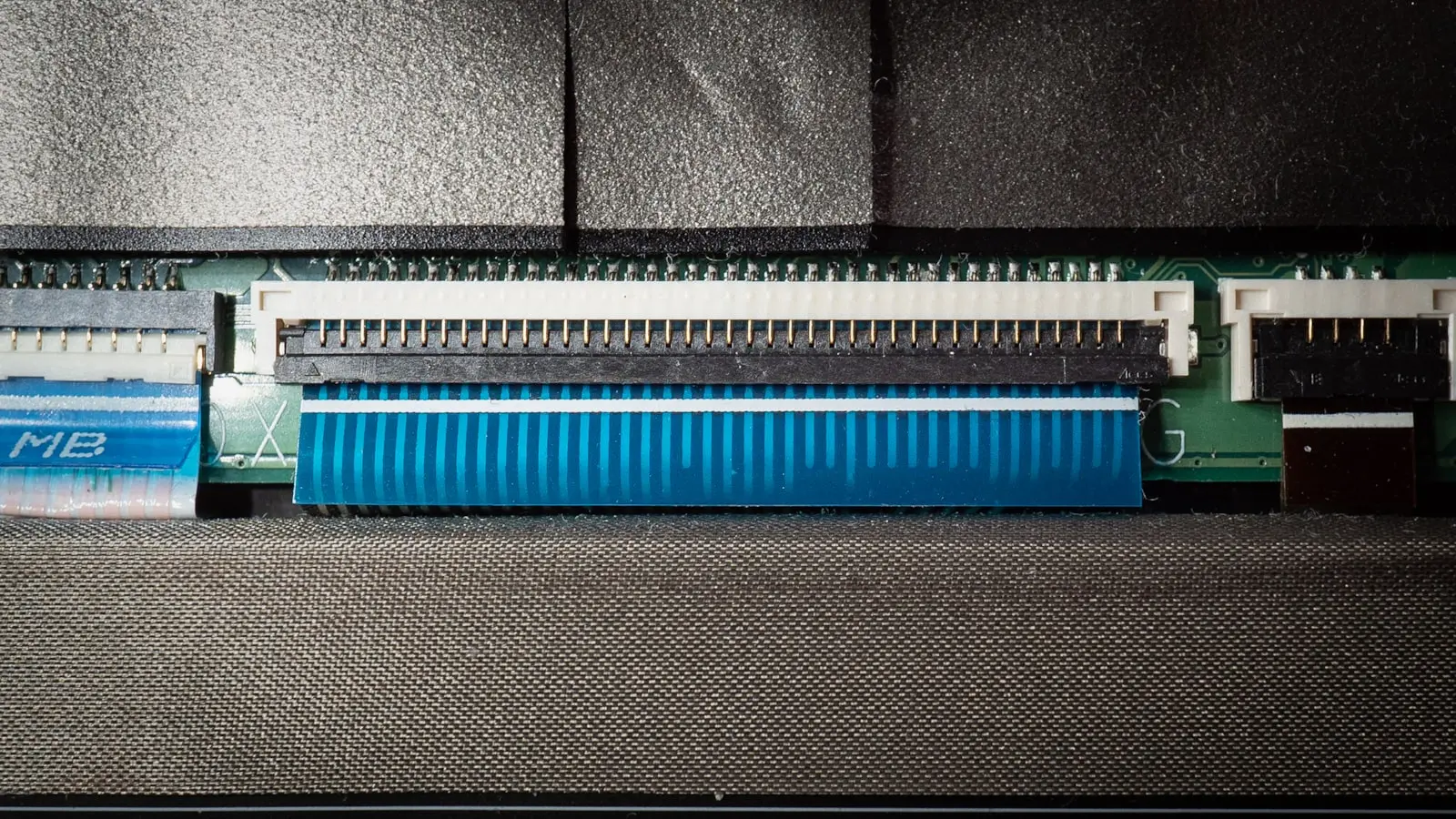 Close-up of car electrical wiring during repair — the kind of harness work a relay-based install requires