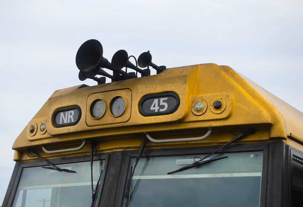 Three-chime air horn mounted on the roof of a locomotive cab