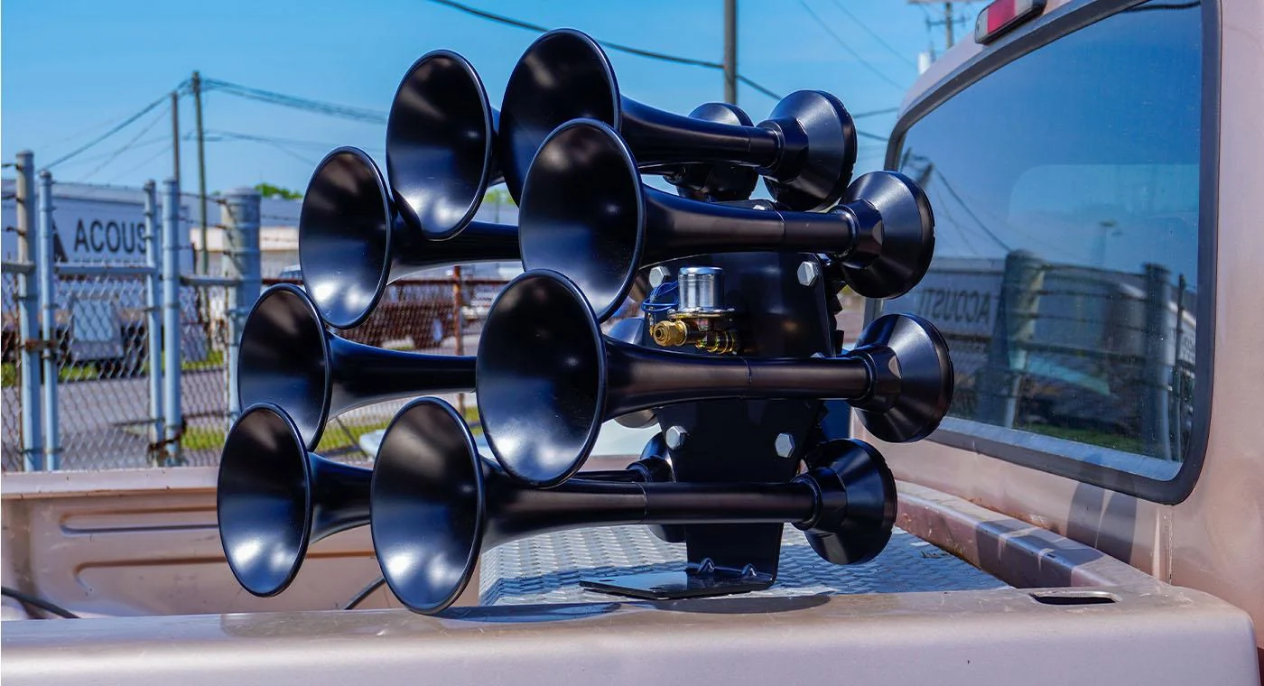 HornBlasters Octohorn eight-bell train horn mounted in a pickup truck bed against the rear window