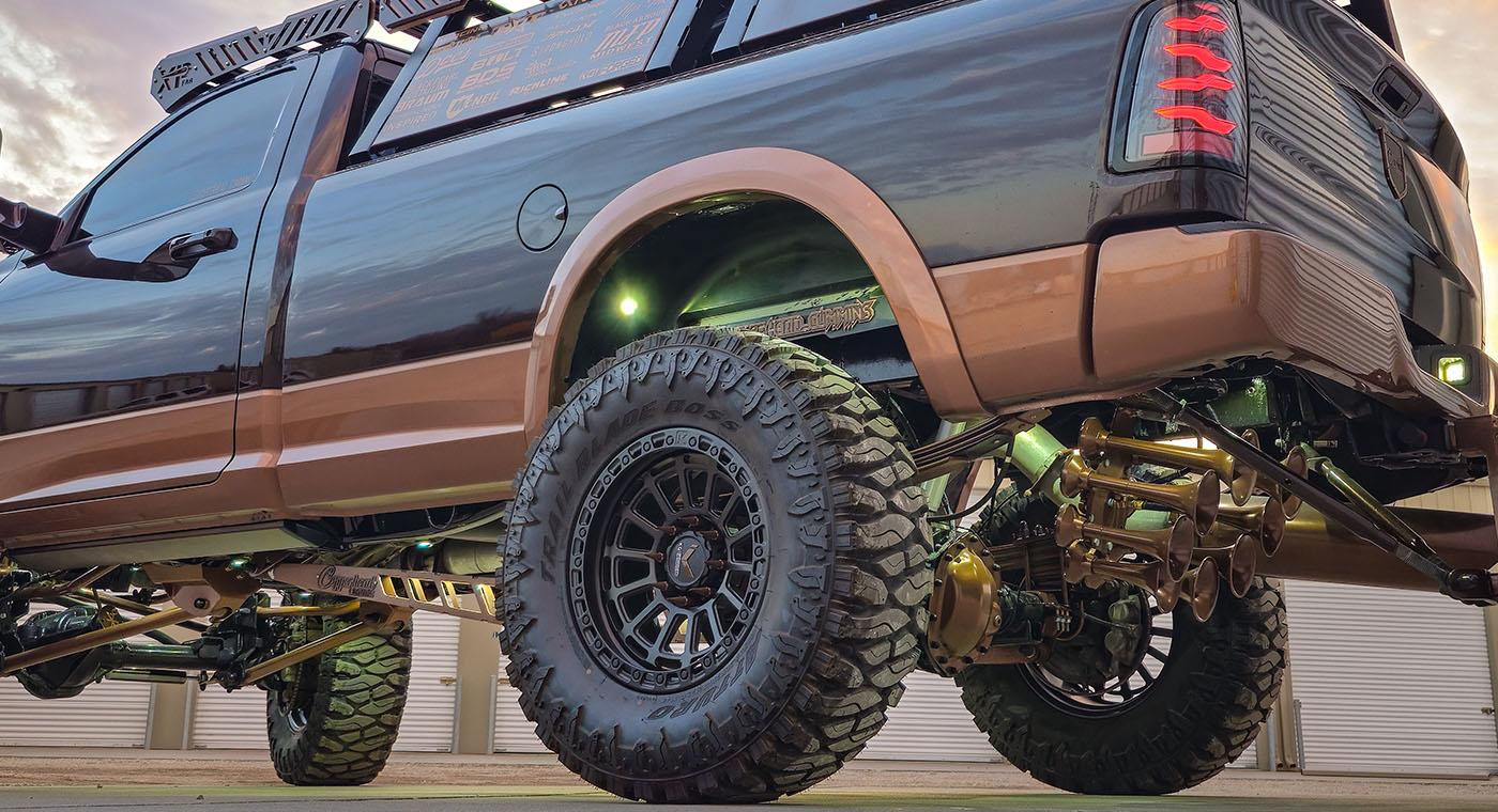 Octohorn eight-bell train horn in a custom bronze finish mounted under the bed of a lifted pickup